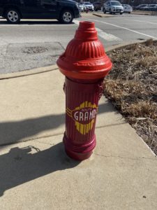 A red fire hydrant that says south grand
