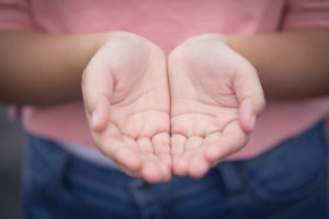 photo of two hands together, palms up