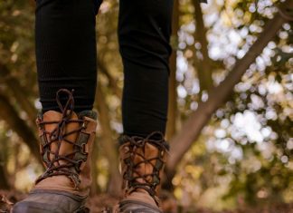 a close up of hiking boots on a trail