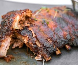 close up photo of barbecue ribs on a plate