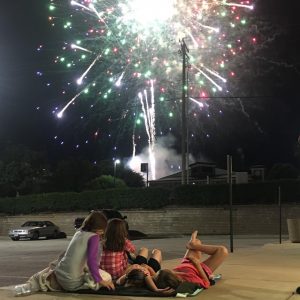 kids laying on a blanket as they watch fireworks in Ellisville, MO