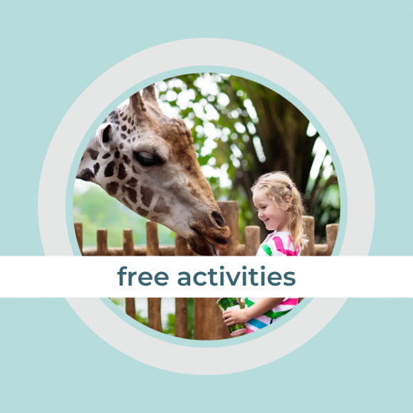 a giraffe leaning down to a little girl with the title: free activities