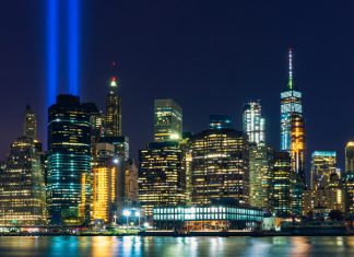 The New York skyline with bright lights shining in place of the Twin Towers