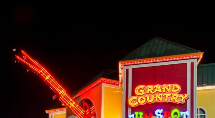 a picture of The Grand Country Fun Spot in Branson, Missouri all lit up at night