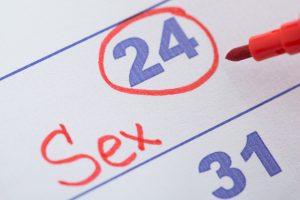 close up of a date circled on the calendar with the word “sex” written in red ink