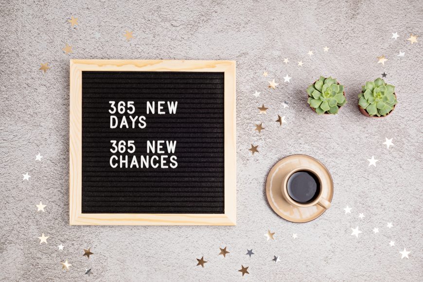 a letterboard with the message, “365 new days, 365 new chances” representing goal setting
