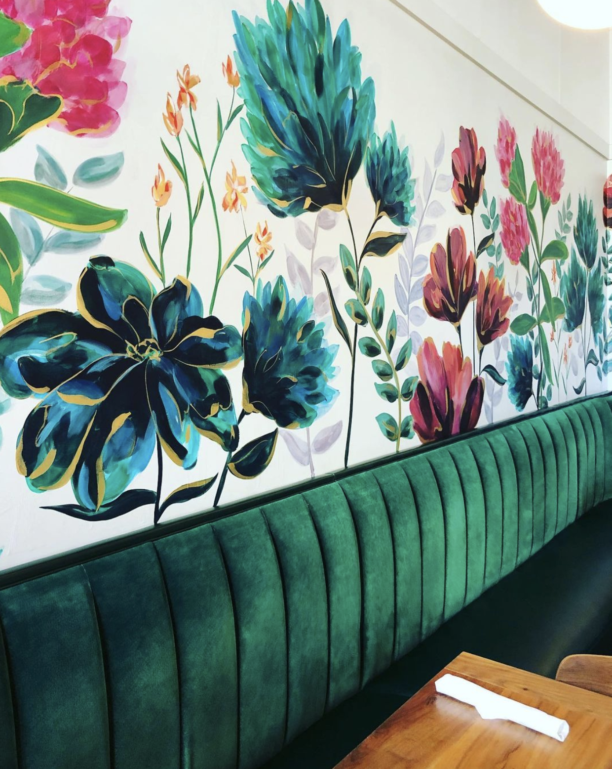 The Clover and The Bee, a St. Louis area eatery with green velvet booths and colorful floral murals on the walls