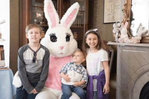 siblings sitting on the Easter Bunny’s lap