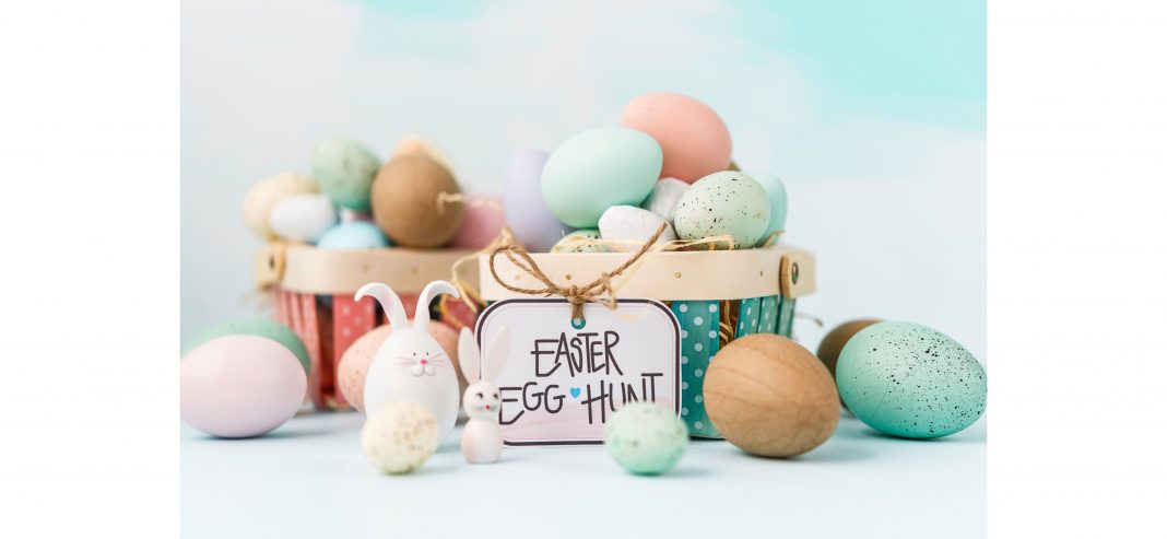 a pastel Easter basket full of colorful eggs with a label on the basket reading, “Easter egg hunt"