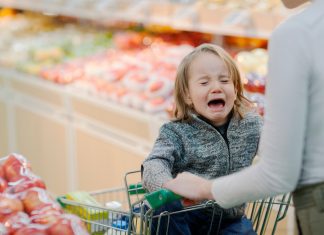 a child having a meltdown in a grocery store