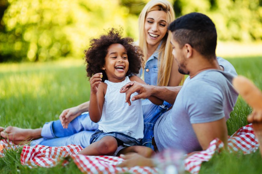 Happy family having fun time together on picnic