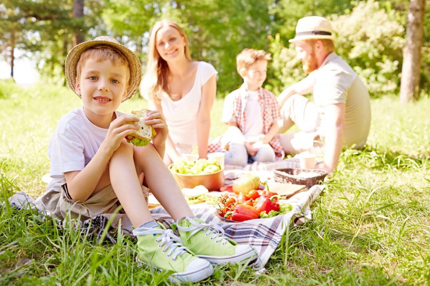 a family picnic in the park as a way of cultivating rest + play this summer