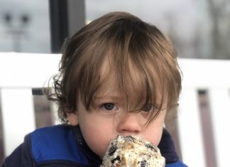 a young boy eating an ice cream cone on a date night: kids edition