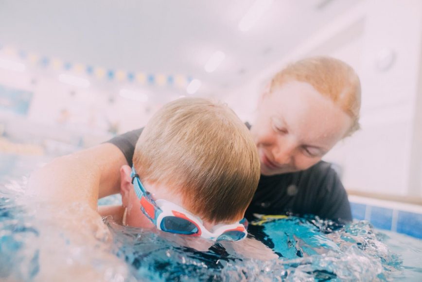 a swim instructor teaching water safety at Foss Swim School in St. Louis