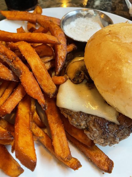 Sweet potato fries with homemade marshmallow fluff dipping sauce with a mushroom swiss burger.