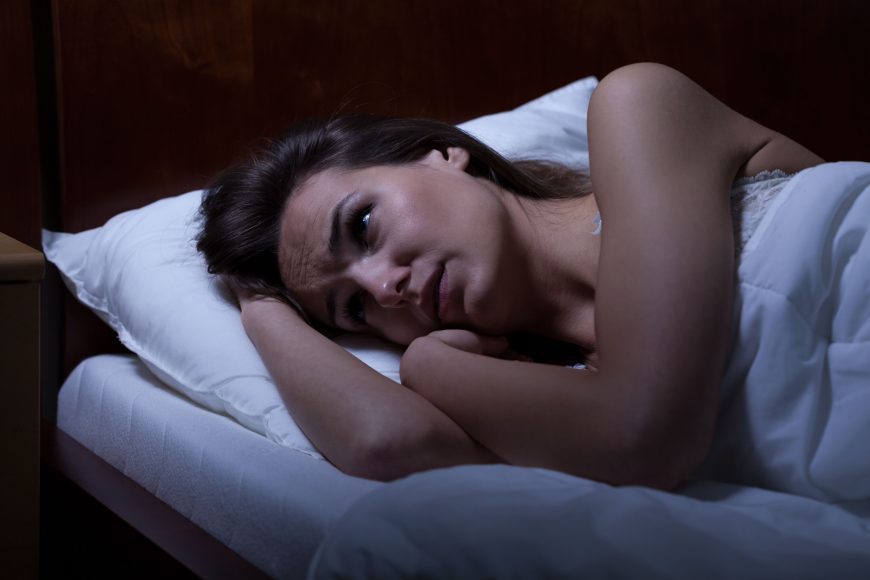 a woman who can’t sleep because she is struggling with her mental health