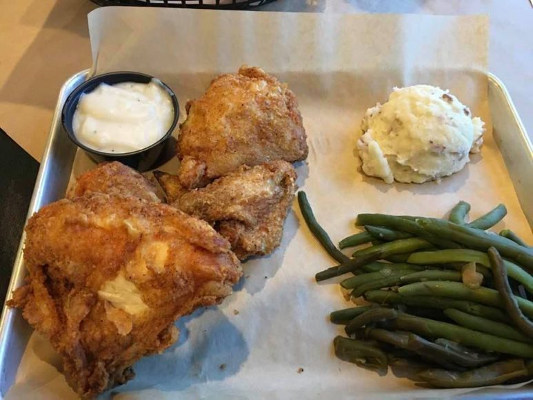 a platter of fried chicken, mashed potatoes, and green beans from Eckert’s Orchard and Restaurant
