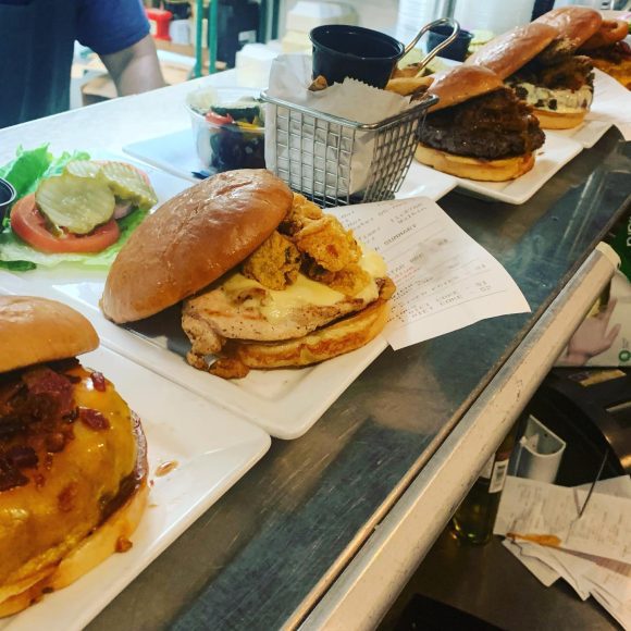 a selection of burgers from 5 Star Burgers in St. Louis