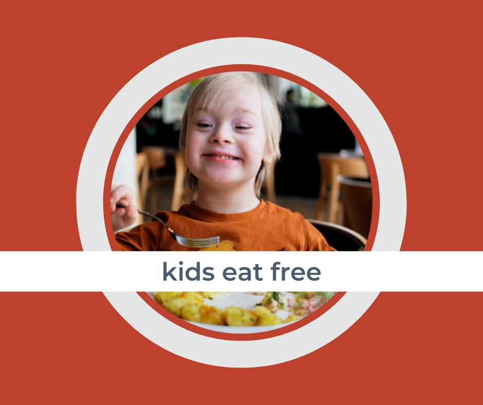 a boy sitting at a restaurant with a banner across the photo saying, “kids eat free” as part of a dining deals guide