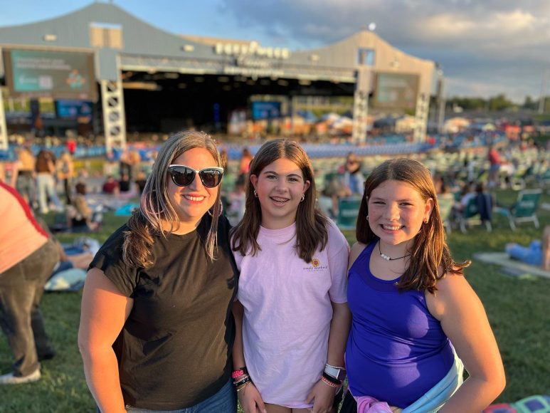 a mom with her two middle school aged daughters at the Pitbull concert in St. Louis, MO