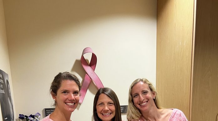 three women in pink hospital gowns as they get mammograms during breast cancer awareness month