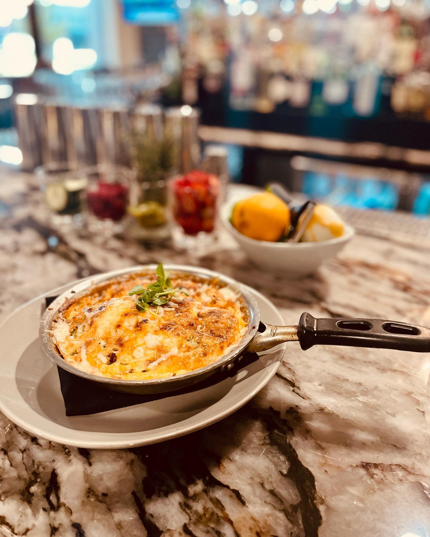 a freshly baked frittata on the counter of a bar in 1818 Chophouse in Edwarrdsville, IL