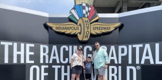 Family standing on top of the winners podium at the Indianapolis Motor Speedway