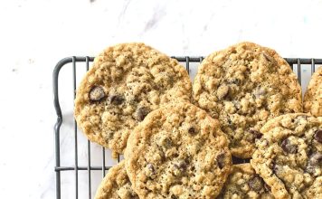 a cooling rack filled with oatmeal cookie on a white countertop